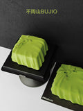 Load image into Gallery viewer, Close-up view highlighting the smooth curves of A Letter from Wind mousse cake.
