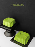 Load image into Gallery viewer, A Letter from Wind mousse cake presented on a sculptural pedestal.