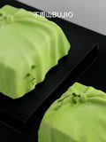 Load image into Gallery viewer, Detailed view of the handcrafted surface of A Letter from Wind matcha yuzu mousse cake.