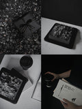 Load image into Gallery viewer, Lifestyle presentation of The Mountain View mousse cake in a contemporary reading setting.