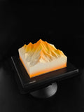 Load image into Gallery viewer, Overview of Up to the Radiance mousse cake inspired by mountain landscapes.