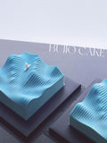 Load image into Gallery viewer, Two Wave to the Life mousse cakes displayed together in a minimalist studio setting.