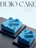 Load image into Gallery viewer, Overview of two Wave to the Life coconut passion fruit mousse cakes.